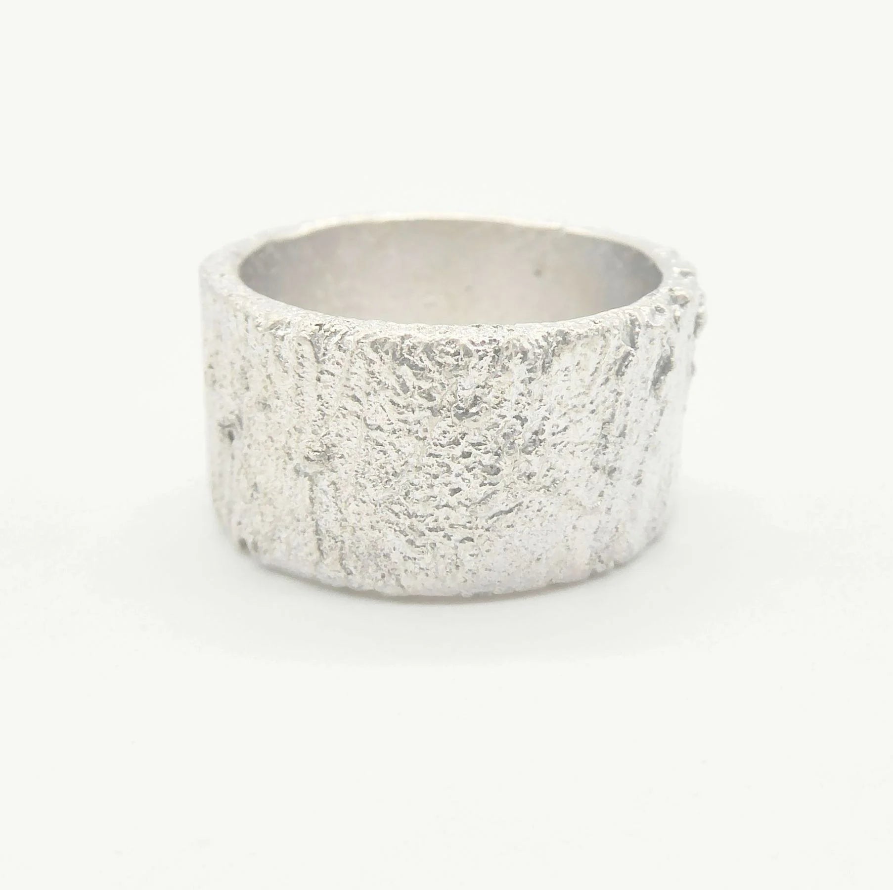 Rivda Frozen Sand 10mm wide textured sterling silver band, handmade in London by Nude Jewellery