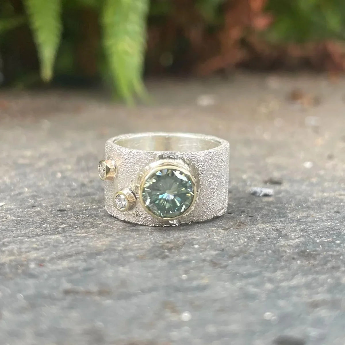 Rivda moissanite and diamond ring in sterling silver with 9ct gold setting — front view