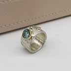 Rivda moissanite and diamond ring in sterling silver with 9ct gold setting — side view