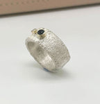 silver rivda sapphire and diamond wide band engagement ring side profile