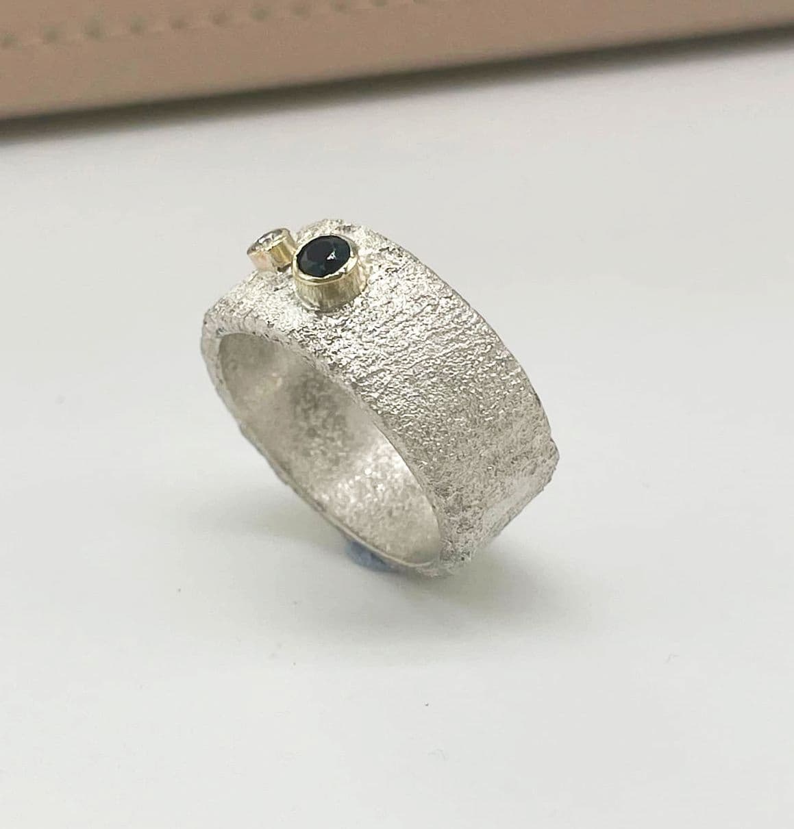 silver rivda sapphire and diamond wide band engagement ring side profile