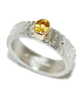 Rivda yellow sapphire ring close-up showing organic silver texture and gold setting detail