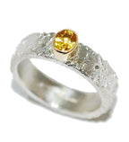 Rivda yellow sapphire ring close-up showing organic silver texture and gold setting detail