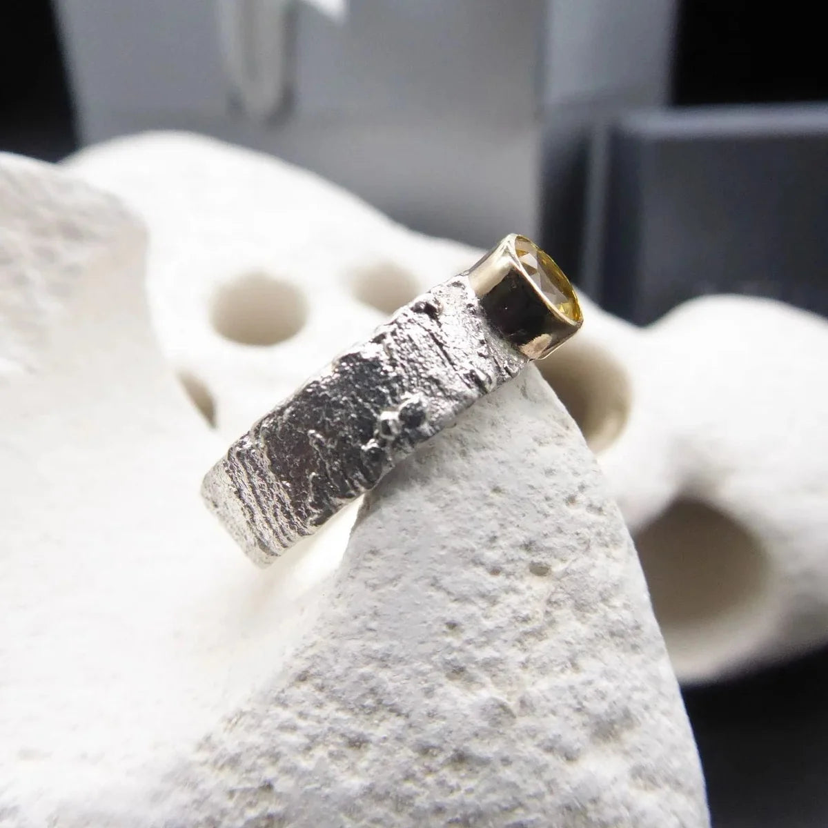 Rivda oval yellow sapphire ring — side view showing band profile and Rivda texture