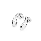 Droplet Silver Stud Earring worn on model — close-up of solid sterling silver droplet stud sitting against lobe