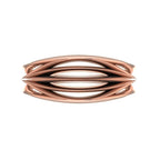 Infinity Armour ring in 18ct rose gold, overhead view showing the continuous interlocking wave pattern catching the light, bold statement or wedding band handmade in London