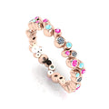 Front three-quarter studio view of the rose gold bubble band, highlighting the modern, fluid arrangement of flush-set diamonds and pastel gemstones.