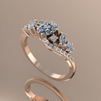 Side profile view of the rose gold Atlantis Storm ring, showcasing the layered wave setting and diamond placement.