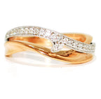 Handmade 18ct rose gold wave-shaped eternity ring featuring a curved band set with pave diamonds.