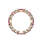 Side profile showing the rose gold claw setting which allows light to pass through the rubies and black diamonds for maximum brilliance.