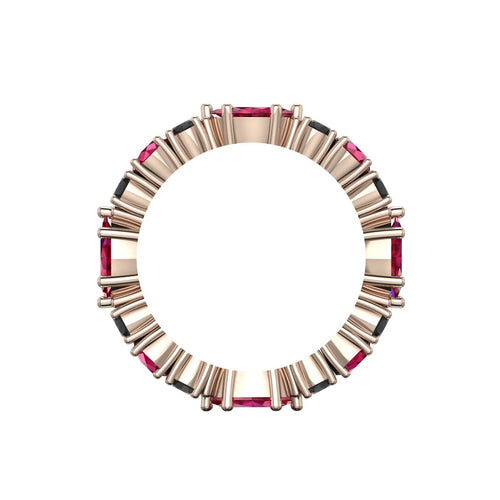 Side profile showing the rose gold claw setting which allows light to pass through the rubies and black diamonds for maximum brilliance.