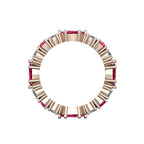 Side profile of the ruby and diamond eternity band showing the delicate 18ct rose gold claw settings.