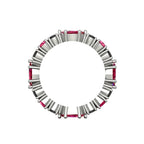 Profile view of the grain-set ruby and black diamond ring showing the polished white gold band.