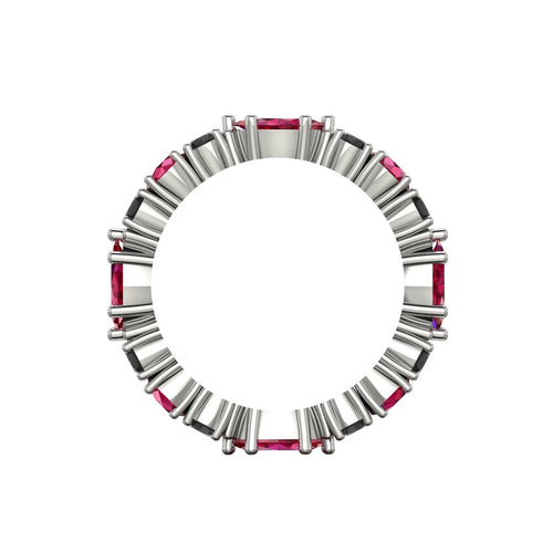 Profile view of the grain-set ruby and black diamond ring showing the polished white gold band.