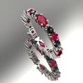 Eternity ring in 18ct white gold featuring alternating marquise rubies and brilliant-cut black diamonds