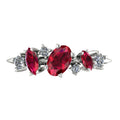 Top view of the Atlantis Paradise ring in 18ct white gold or platinum, featuring an asymmetrical cluster of red rubies and brilliant-cut diamonds.