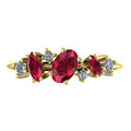 Top view of the 18ct yellow gold Atlantis Paradise ring featuring an asymmetrical cluster of red rubies and brilliant-cut diamonds.