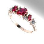 An angled view of the Atlantis Paradise ring highlighting the three-dimensional layout of the ruby and diamond cluster.