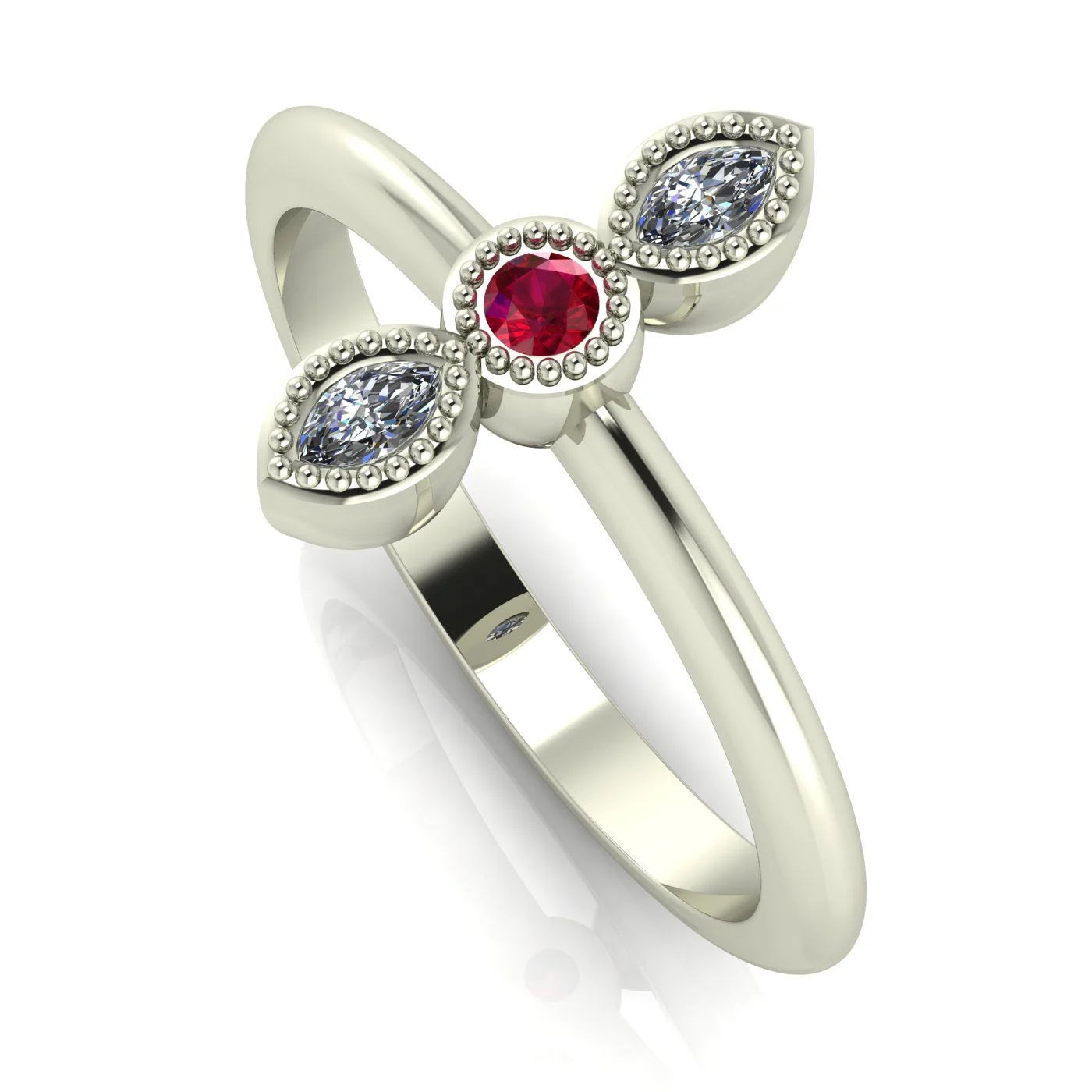 Angled view of an 18ct white gold trilogy ring with a ruby and diamonds featuring fine milgrain textured edges.