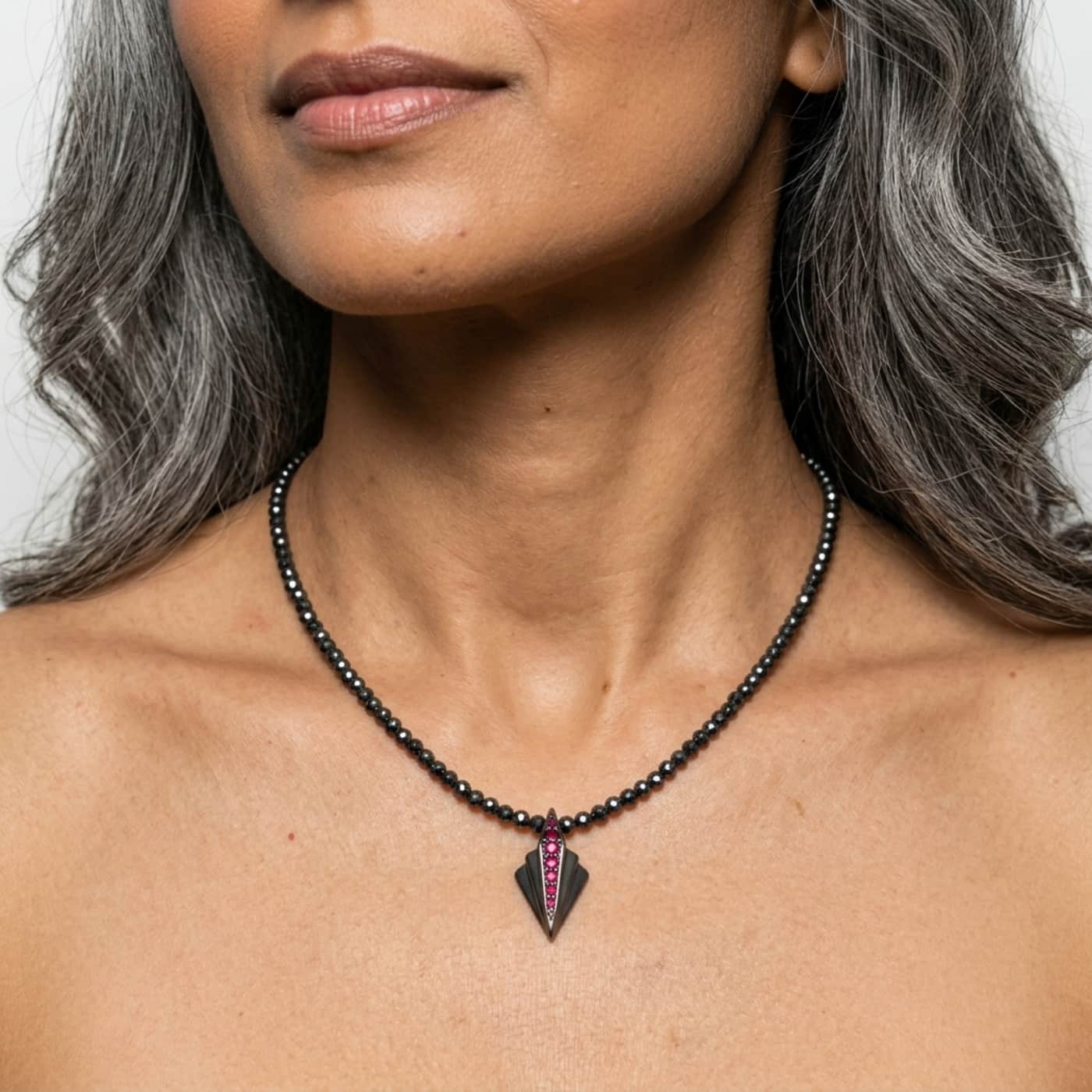 Art Deco silver ruby and hematite geometric pendant necklace worn on model showing length and scale