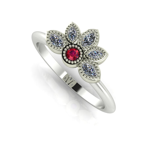 Angled view of a ruby and marquise diamond cluster engagement ring in a polished white metal setting.