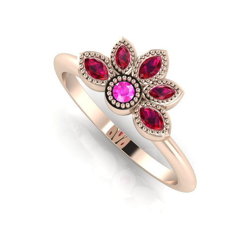 Angled perspective of a ruby and pink sapphire cluster ring in 18ct rose gold with fine milgrain textured edges.