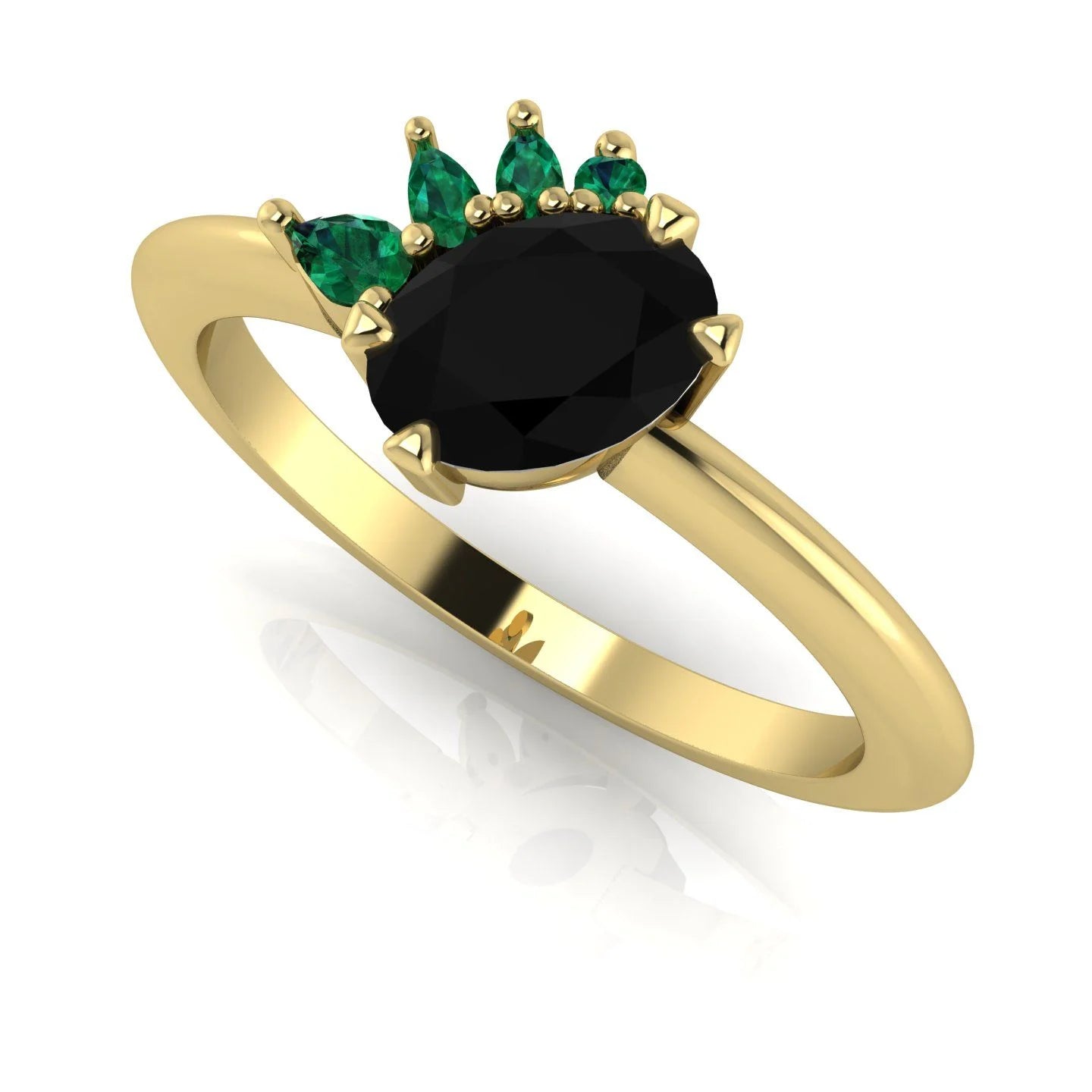Selene black diamond and emerald engagement ring in 18ct yellow gold three-quarter view showing emerald crown cluster detail