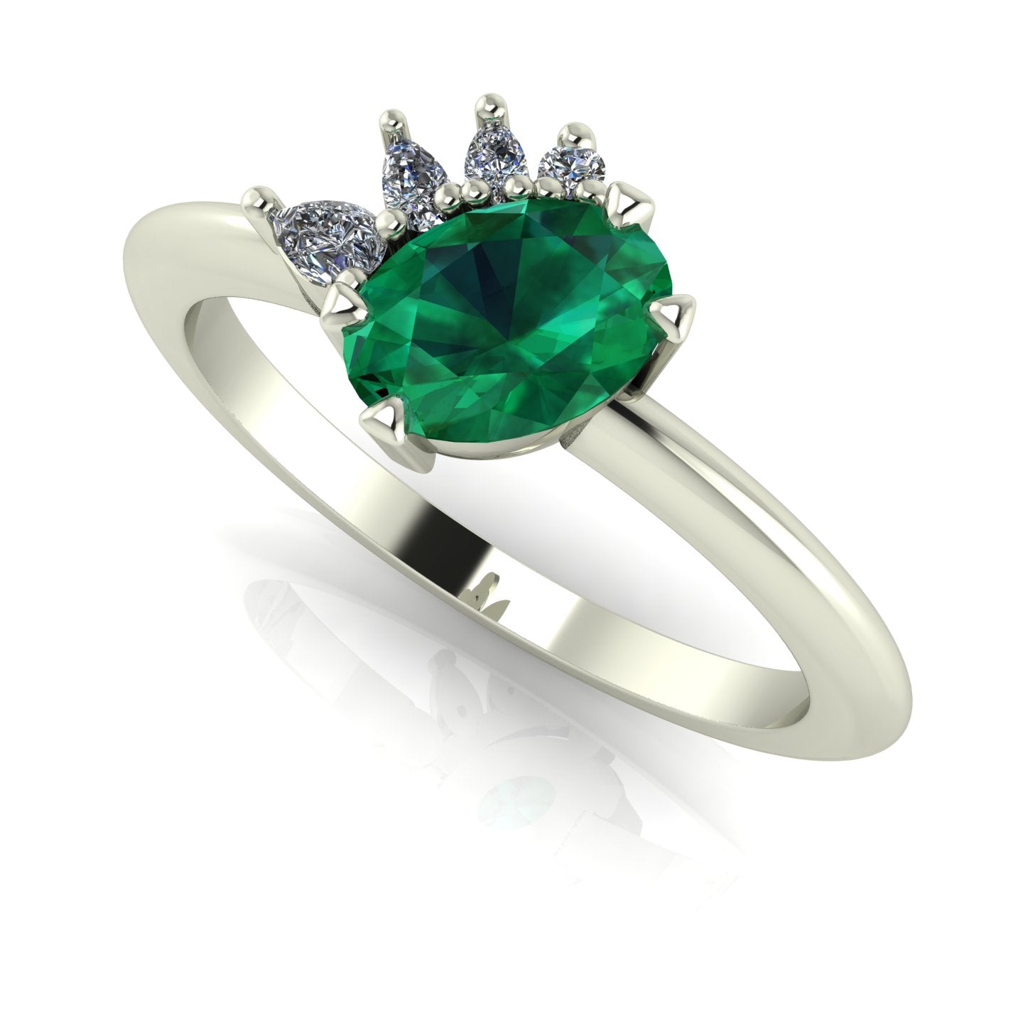 Front three-quarter studio view of the Selene emerald ring, highlighting the unique, architectural layout of the cluster diamonds against the white gold or platinum shoulders.