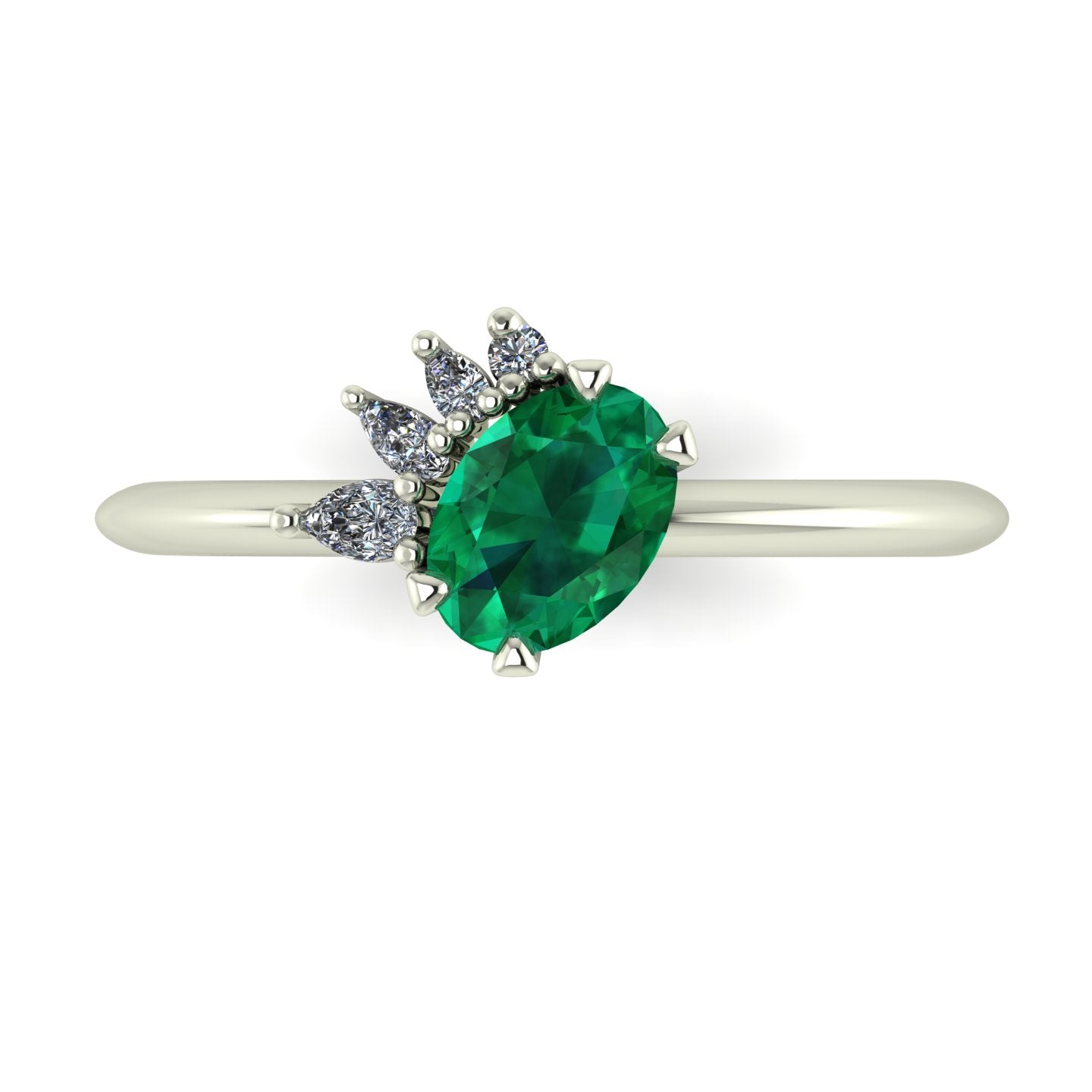 High angle studio detail shot of the Selene alternative engagement ring, showcasing the deep green depth of the emerald contrasting with the bright white metal and diamond facets.