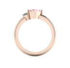 Through-finger view of the 18ct rose gold cluster ring, showing the clean interior structure and the intricate under-gallery precisely supporting the precious stones.