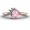 Top-down studio hero shot of the Selene cluster engagement ring, featuring a beautiful oval morganite nestled within an asymmetric white diamond arrangement on an 18ct rose gold band.
