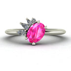 Selene oval pink sapphire and diamond engagement ring in white gold front view showing asymmetric pear and round diamond cluster