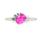 Selene oval pink sapphire and diamond engagement ring in white gold top-down view showing vivid pink sapphire and asymmetric pear diamond cluster