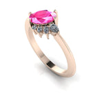 Front three-quarter studio view of the Selene pink sapphire ring, highlighting the unique crown-like arrangement of brilliant cluster diamonds against the rose gold setting.