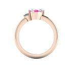Through-finger view of the 18ct rose gold cluster ring, showing the clean interior structure and intricate under-gallery supporting the pink sapphire.