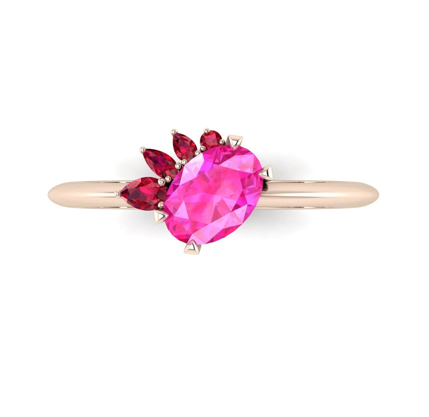 High angle studio detail shot of the Selene alternative engagement ring, showcasing the rich colour depth and light reflection across the pink sapphire and red ruby facets.