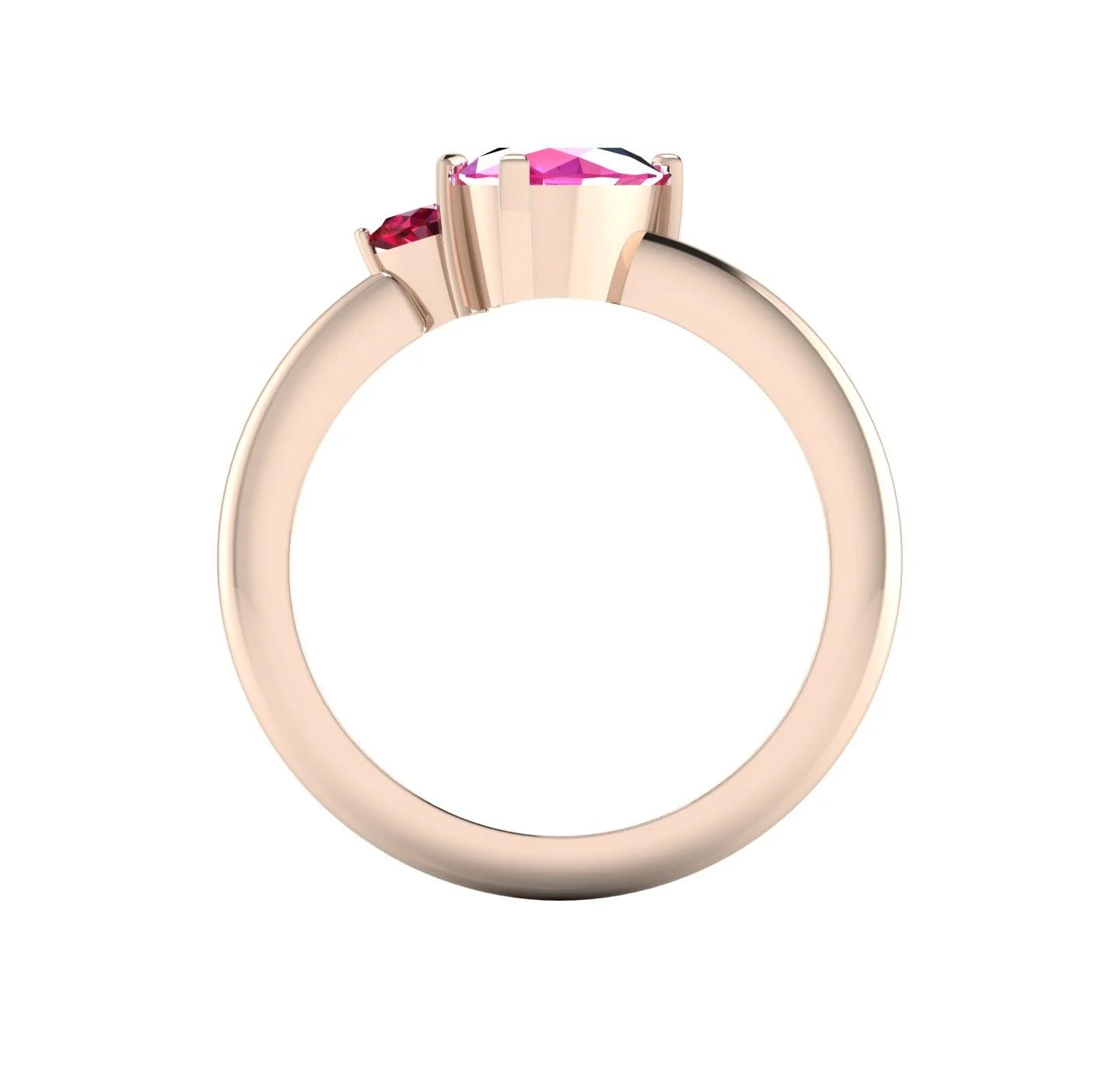 Through-finger view of the 18ct rose gold cluster ring, showing the clean interior structure and the intricate under-gallery supporting the sapphire and rubies.