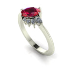 Selene oval ruby and diamond engagement ring in 18ct white gold three-quarter view showing diamond cluster detail and polished band