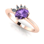 Selene oval violet sapphire and diamond engagement ring in 18ct rose gold three-quarter view showing diamond cluster detail and polished band