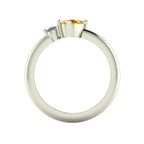 Through-finger view of the white gold or platinum cluster ring, showing the clean interior structure and intricate under-gallery supporting the stones.
