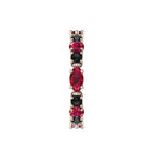 Detailed macro view of the rose gold claws securely holding the marquise-cut rubies and round black diamonds.