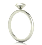 Angled perspective of a solid silver rock solitaire ring with geometric facets.