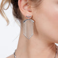 Front view of handmade silver falling earrings showing the movement of the chain and droplets.