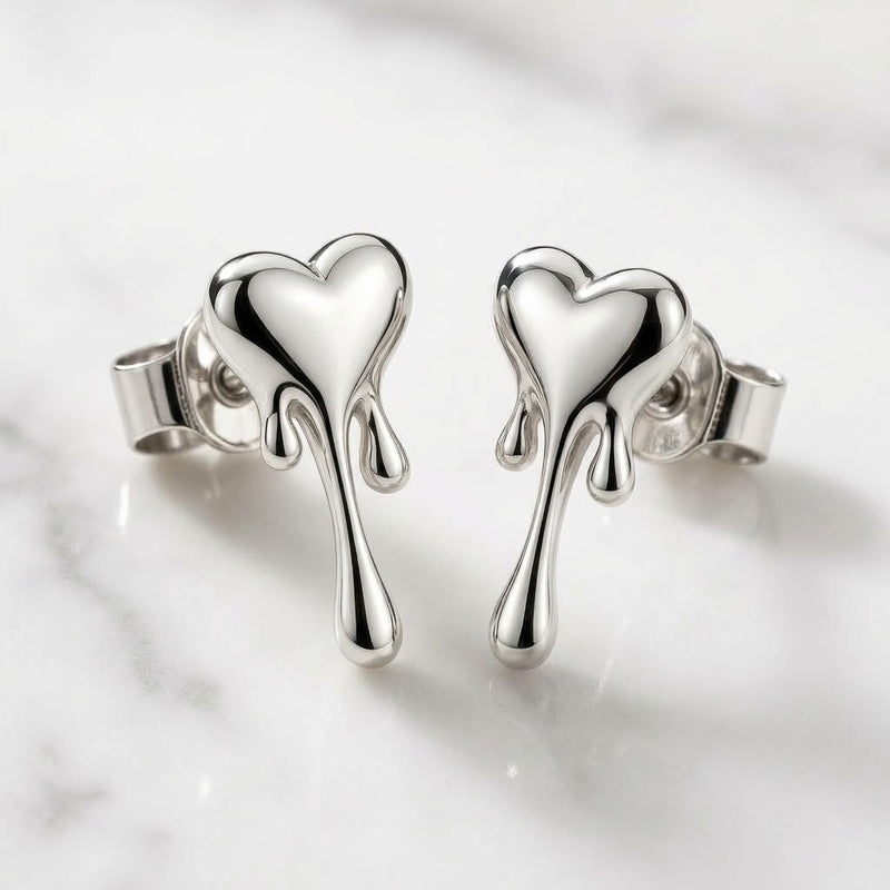 Pair of silver melting heart earrings with polished hearts and three trailing drip details.