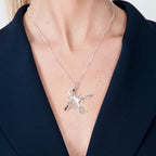Sterling silver Splat pendant on a delicate chain, close up on model image.