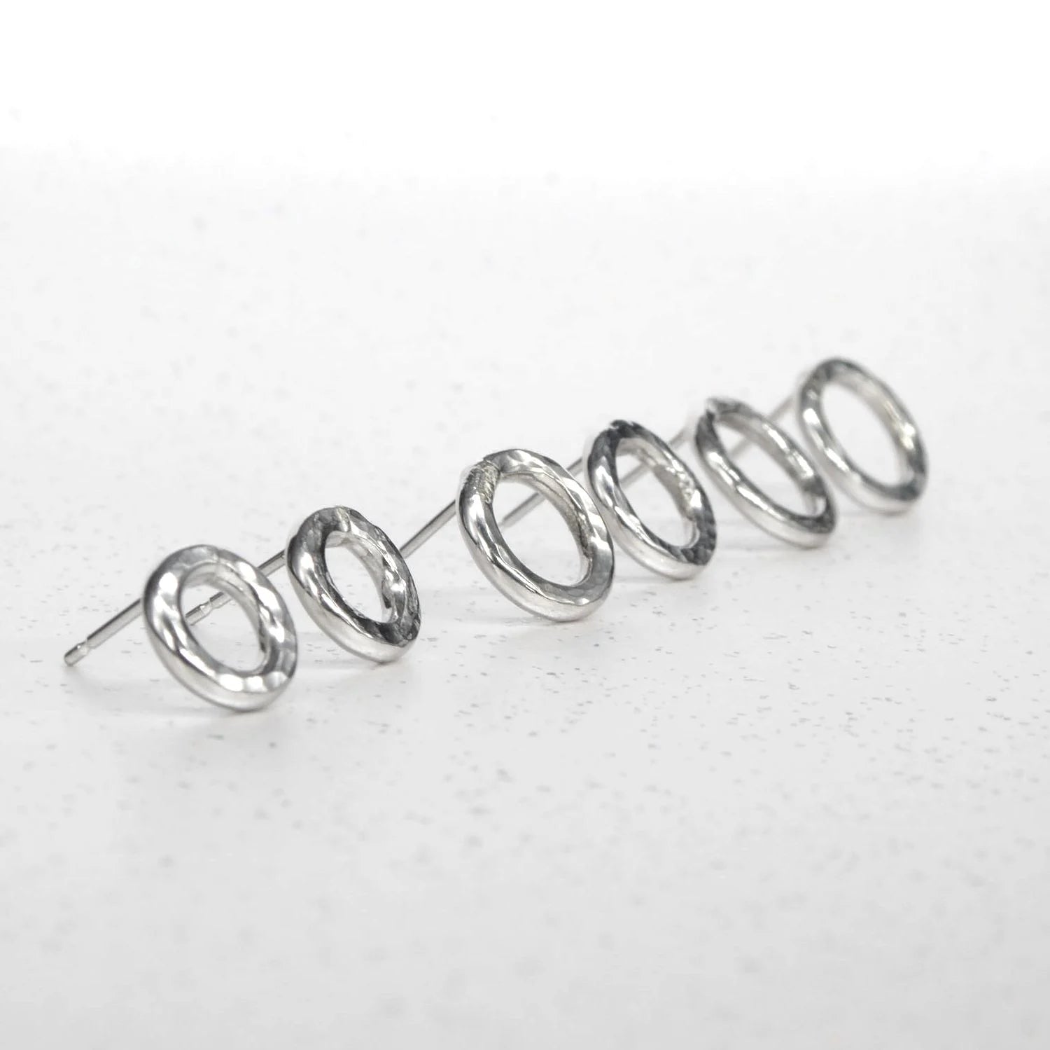 Front view of handmade 14mm sterling silver Vanilla earrings featuring a textured design.