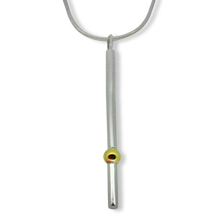 A front-facing view of the Solis bar pendant, showing the vertical, minimalist recycled silver bar with a single 9ct gold sphere positioned at the base.