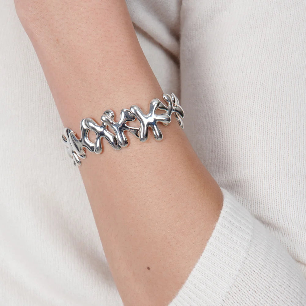 Silver Splat sterling silver link bracelet showing its fluid abstract contours and T-bar clasp