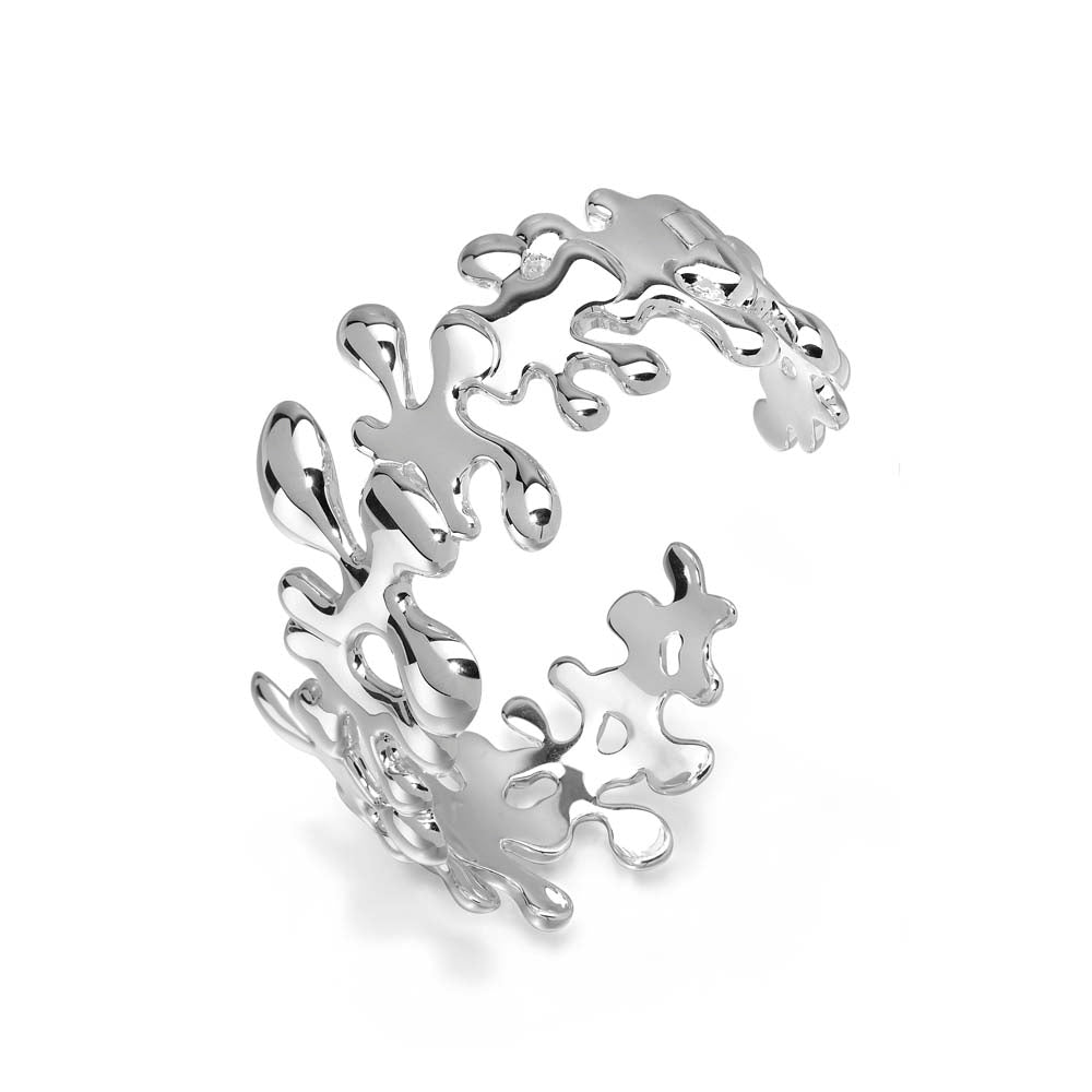 Side hero shot of the handmade sterling silver Splat cuff bracelet, featuring a wide fluid asymmetrical design.