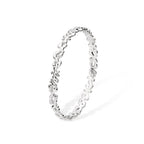 Side view of the thin silver Splash bangle highlighting the slender, organic shape and polished surface.